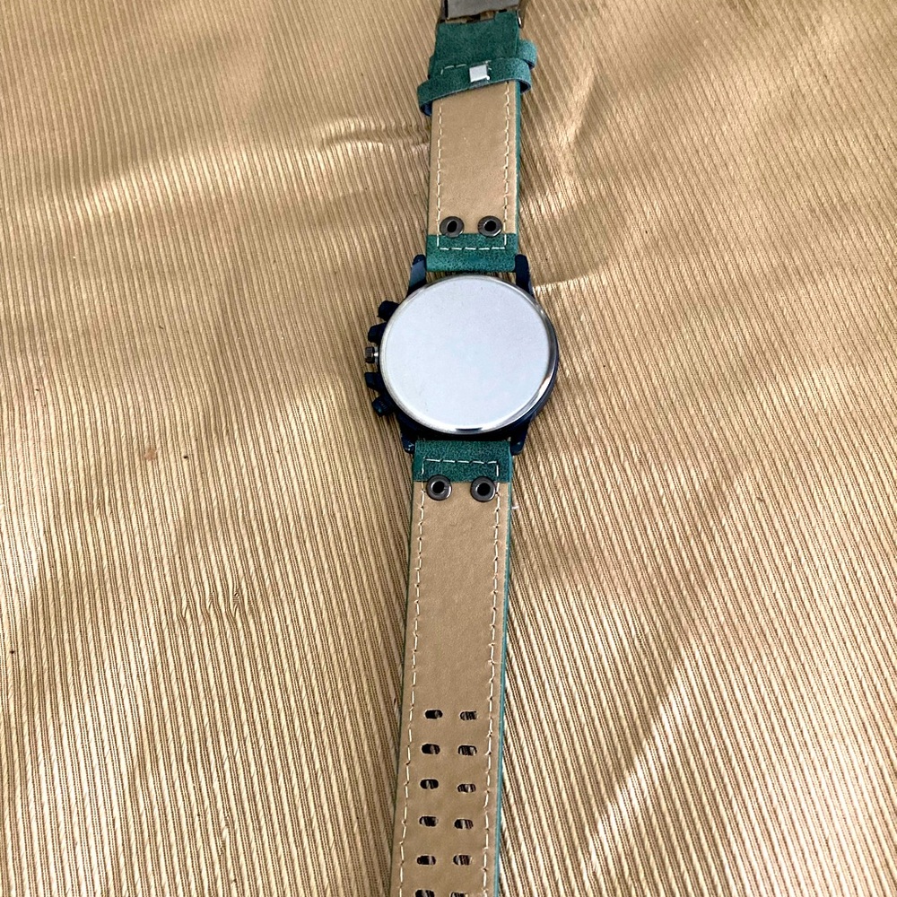 Nicely created leather with suede feel on the band.